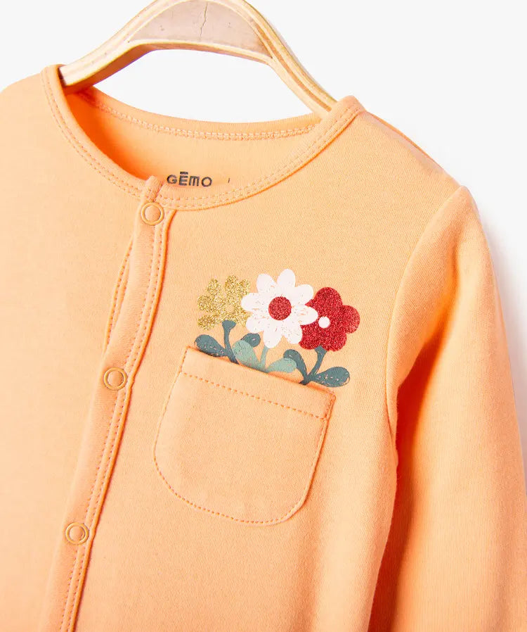 Grenouillère orange avec imprimé fleur