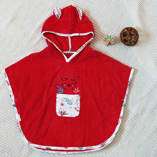 Poncho de bain rose , Petit béguin 
Filou & Loulou. Dakar-Sénégal