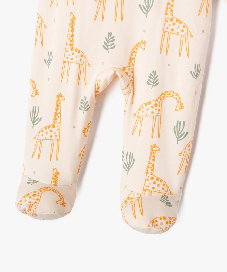 Grenouillère écru à motifs girafes et touches pailletées