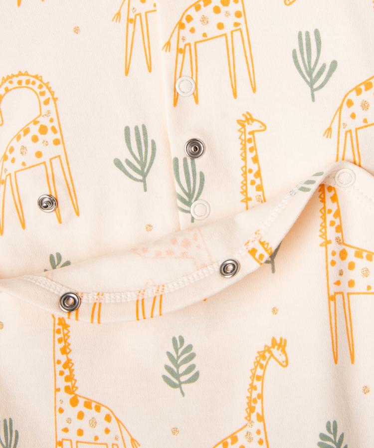 Grenouillère écru à motifs girafes et touches pailletées